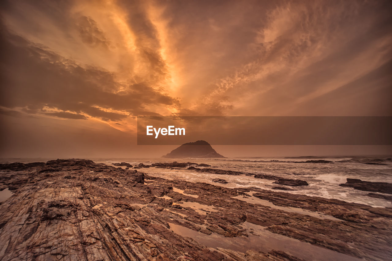 View of beach at sunset