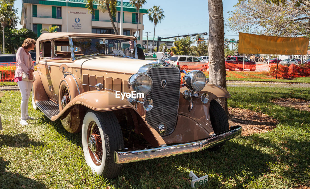 VINTAGE CAR PARKED IN PARK