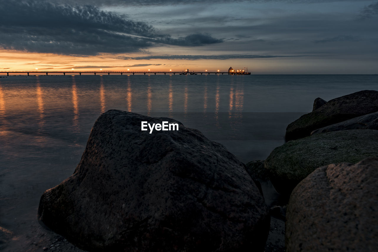 Scenic view of sea against sky at sunset