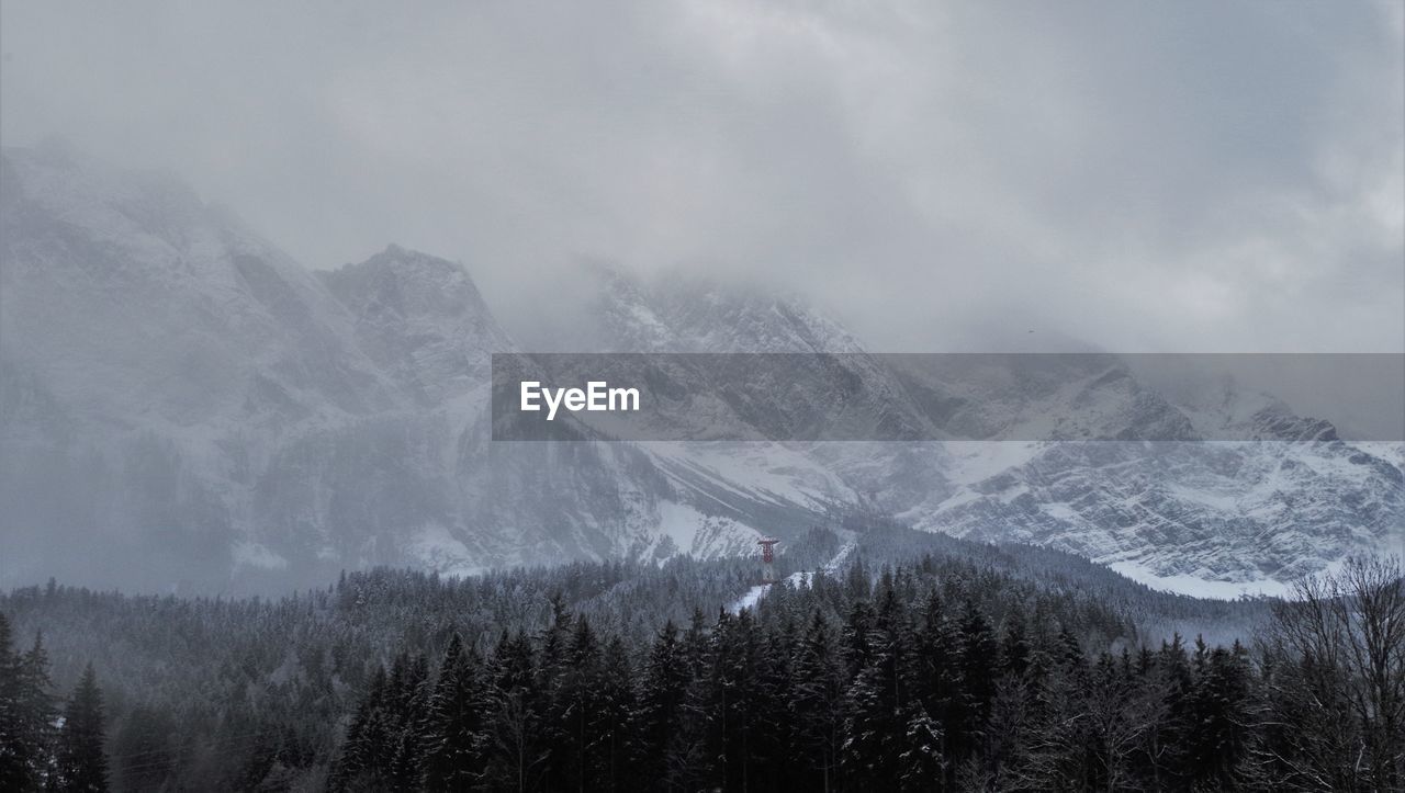 Scenic view of mountains against sky during winter