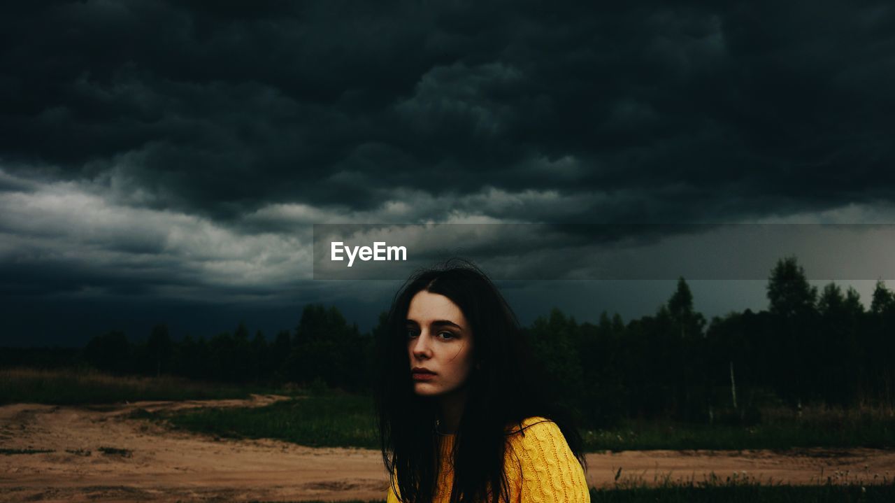 Young woman standing on field