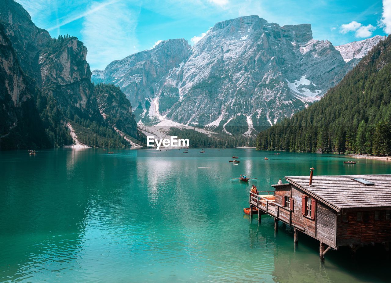 scenic view of lake and snowcapped mountains against sky