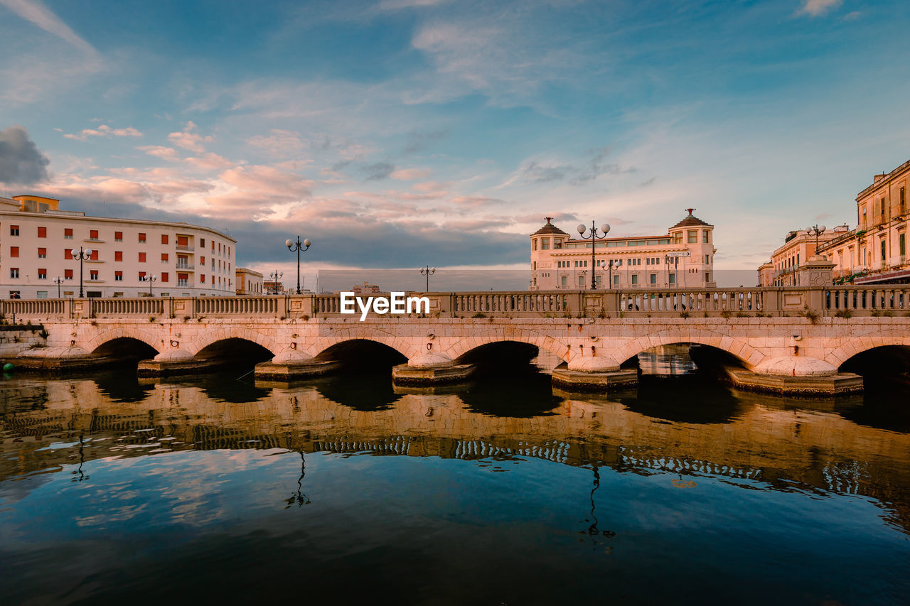 Port of ortigia with prestigious hotel in the background