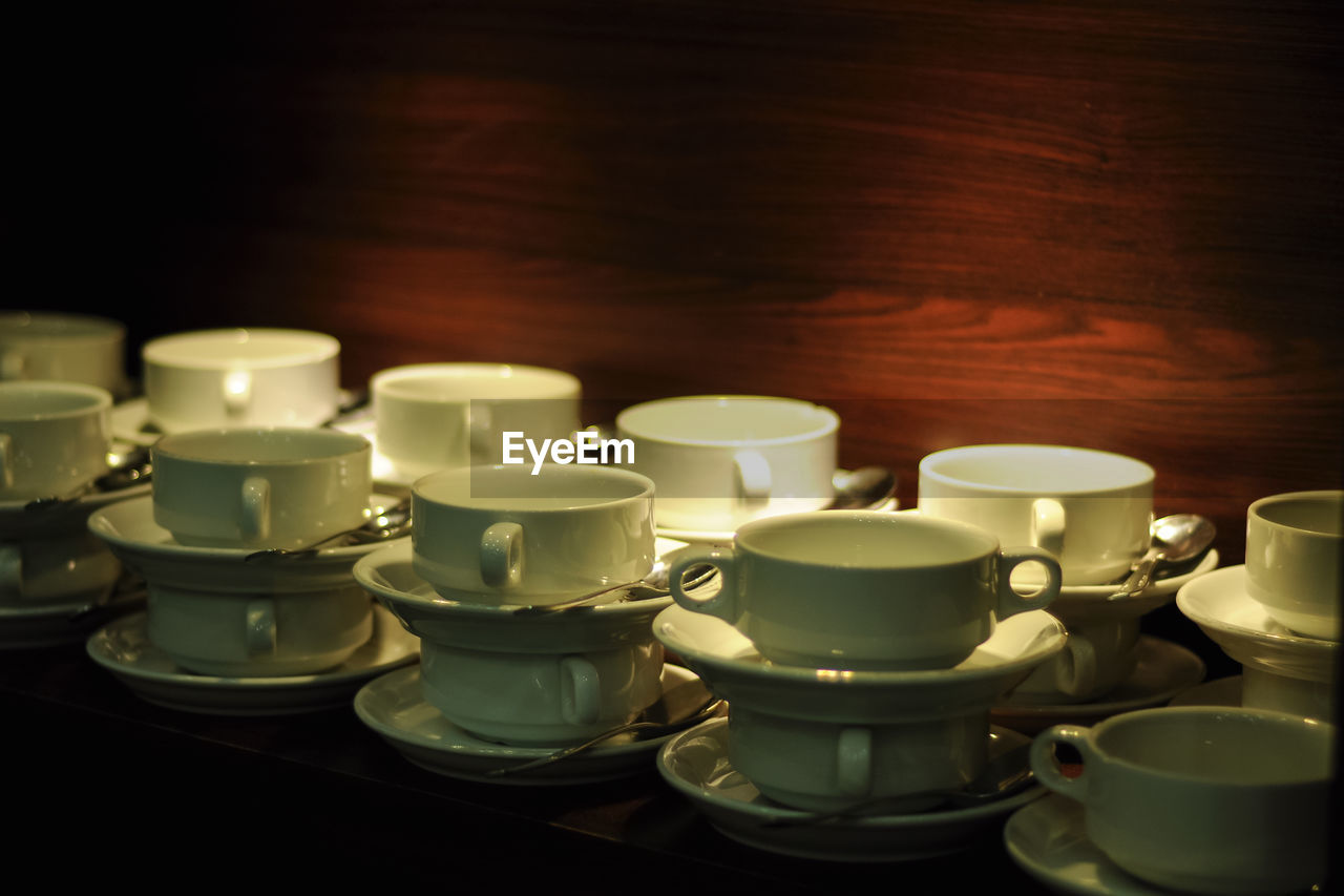 Close-up of empty coffee cups on table