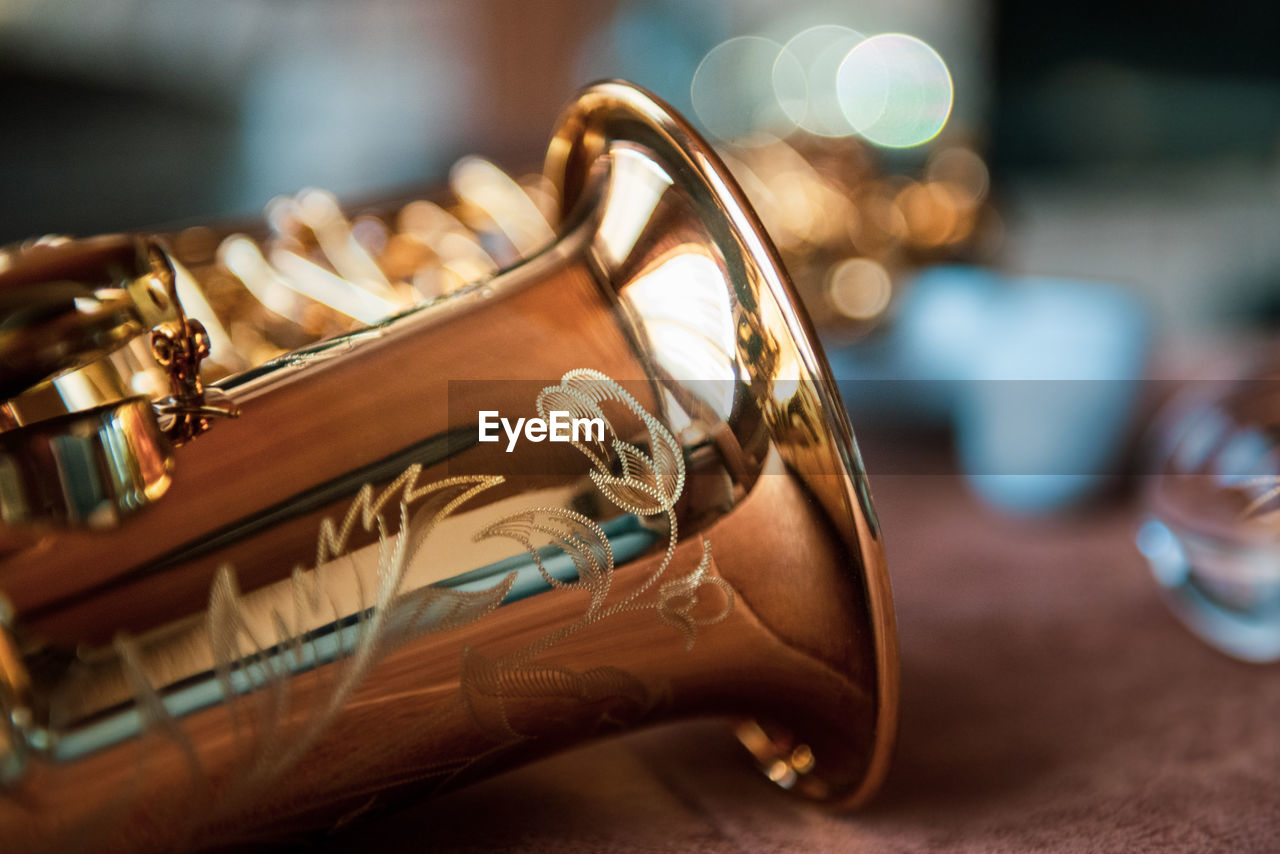 Close-up of alto saxophone on table