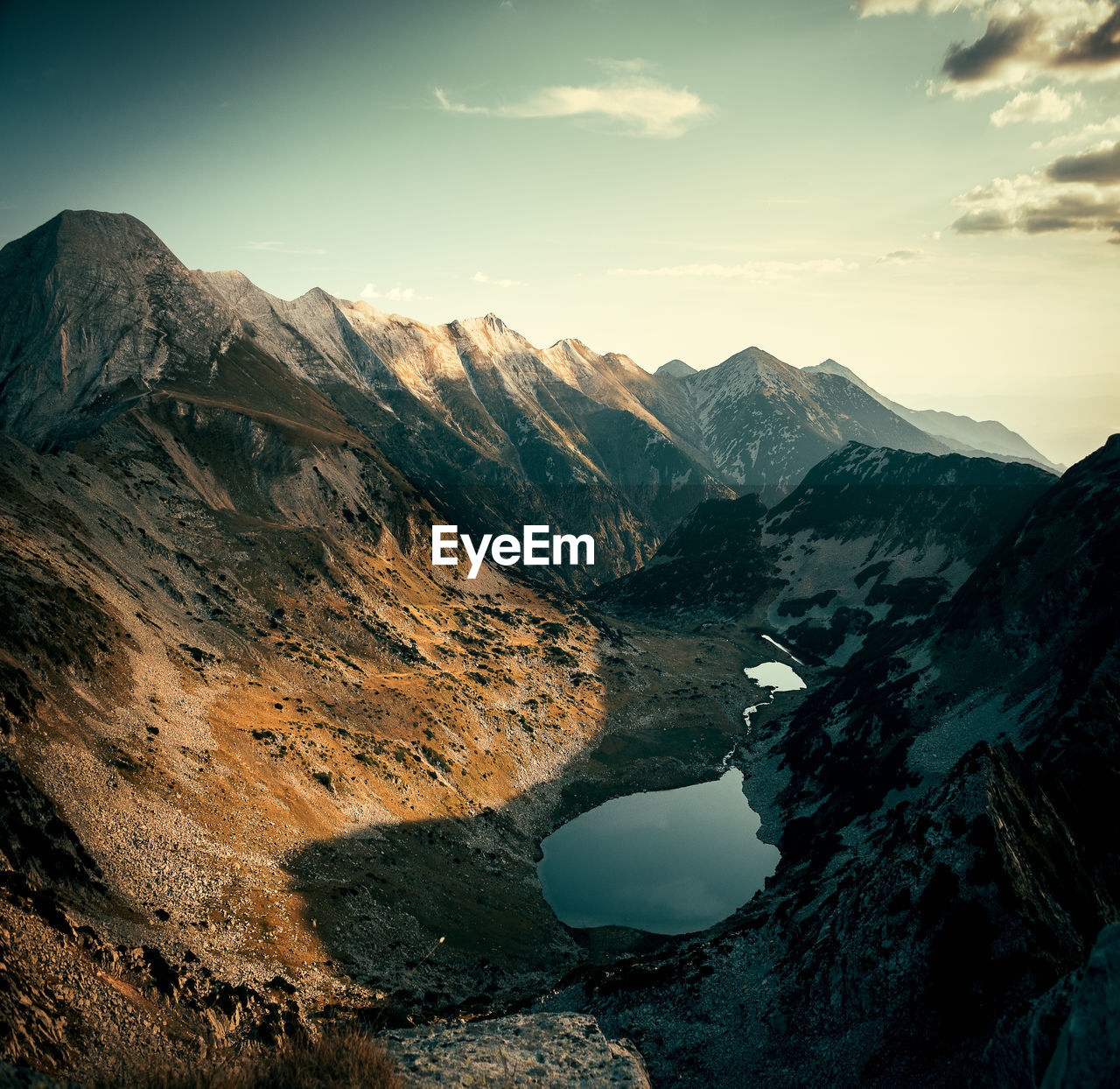 Scenic view of mountains against sky during sunset