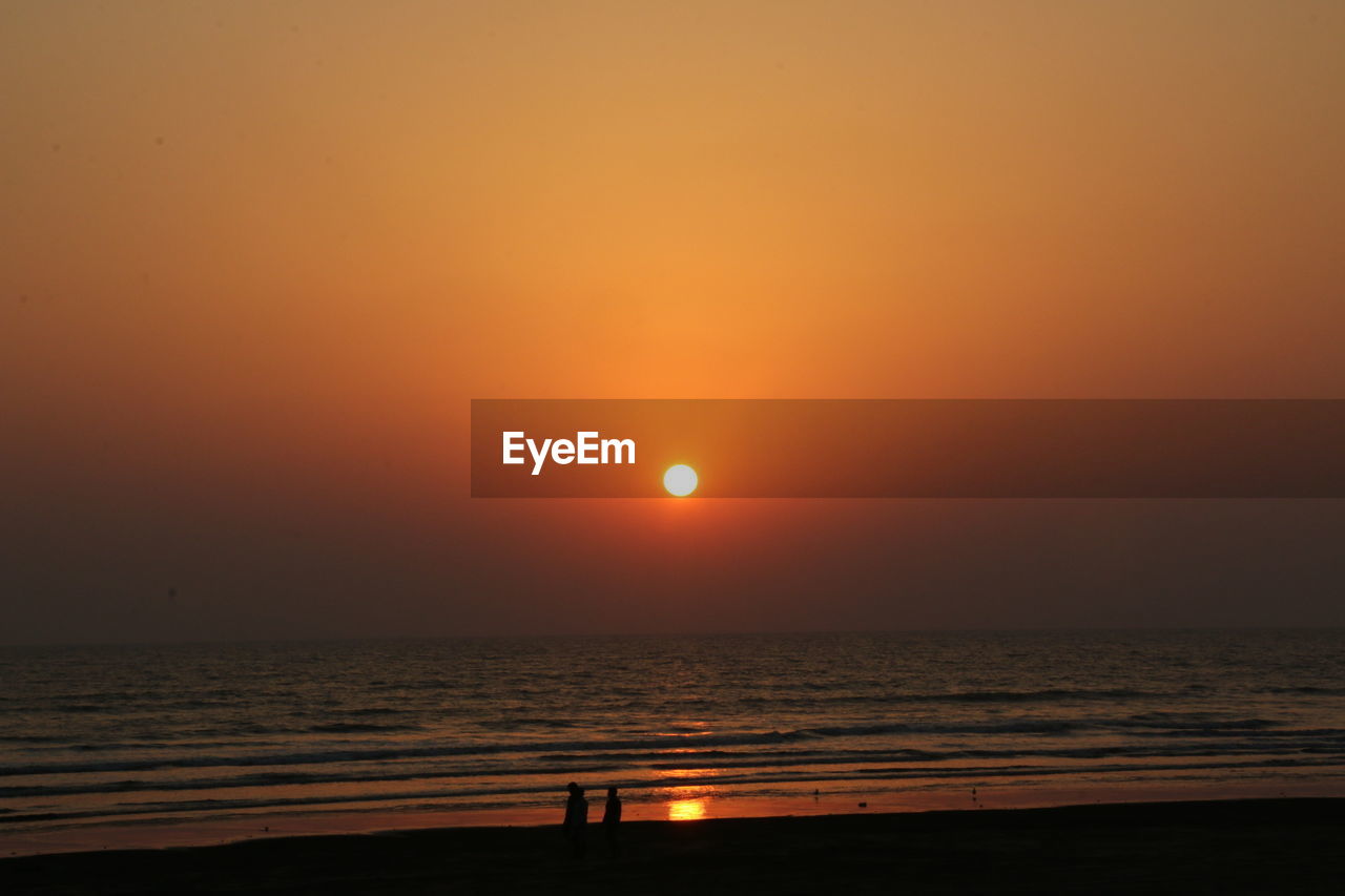 VIEW OF SEA AT SUNSET