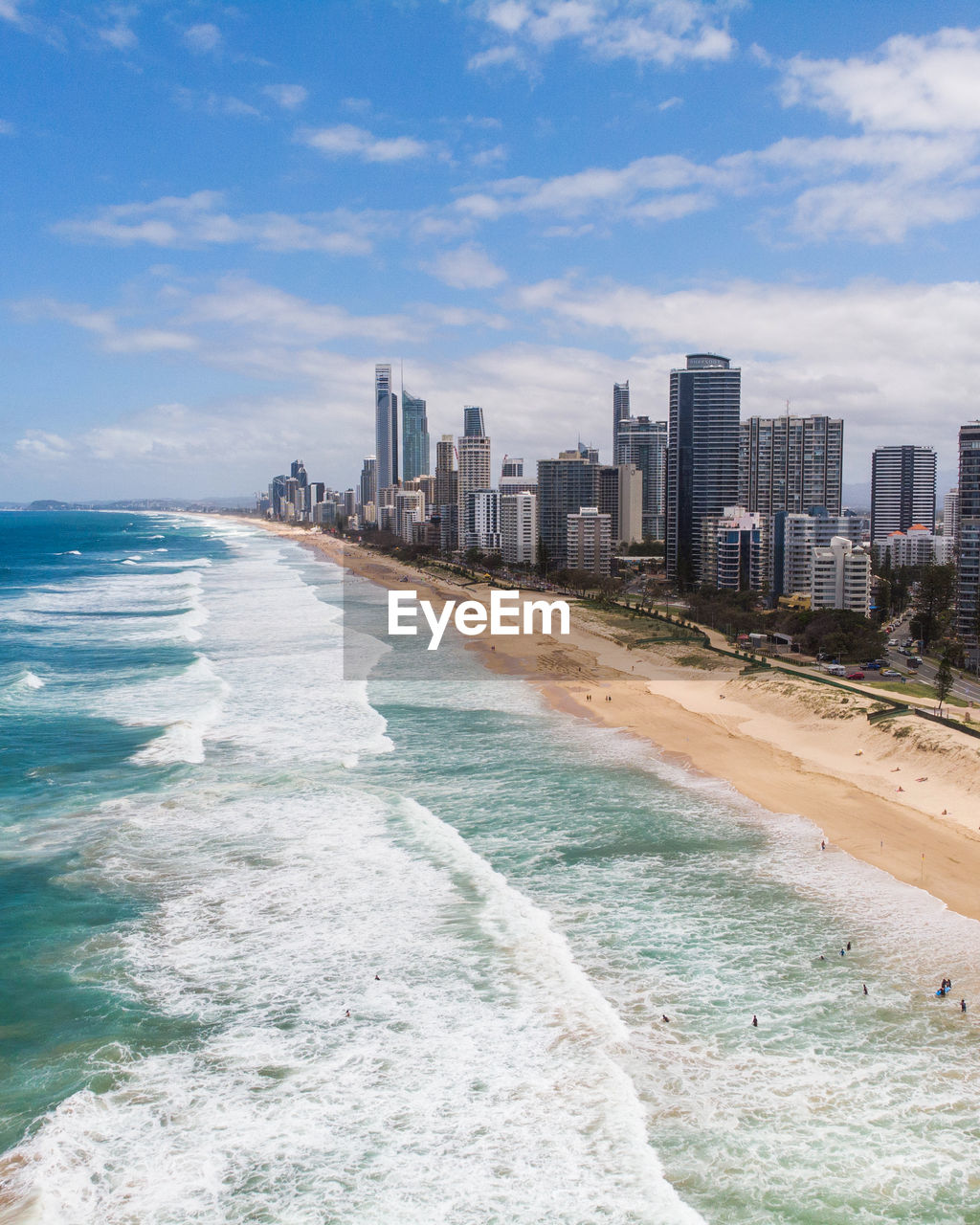 Panoramic view of beach and buildings against sky