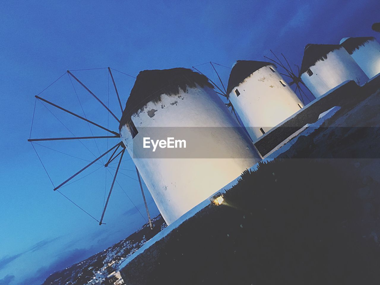LOW ANGLE VIEW OF WINDMILL AGAINST BLUE SKY