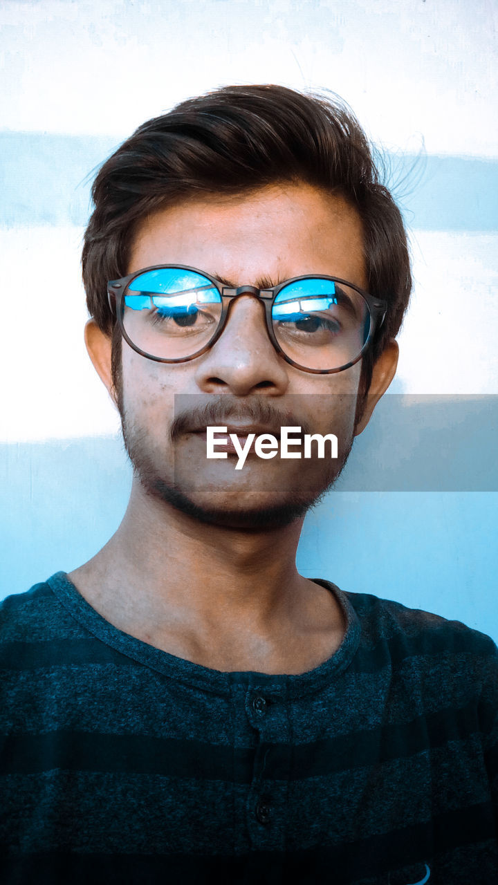 Portrait of young man in eyeglasses