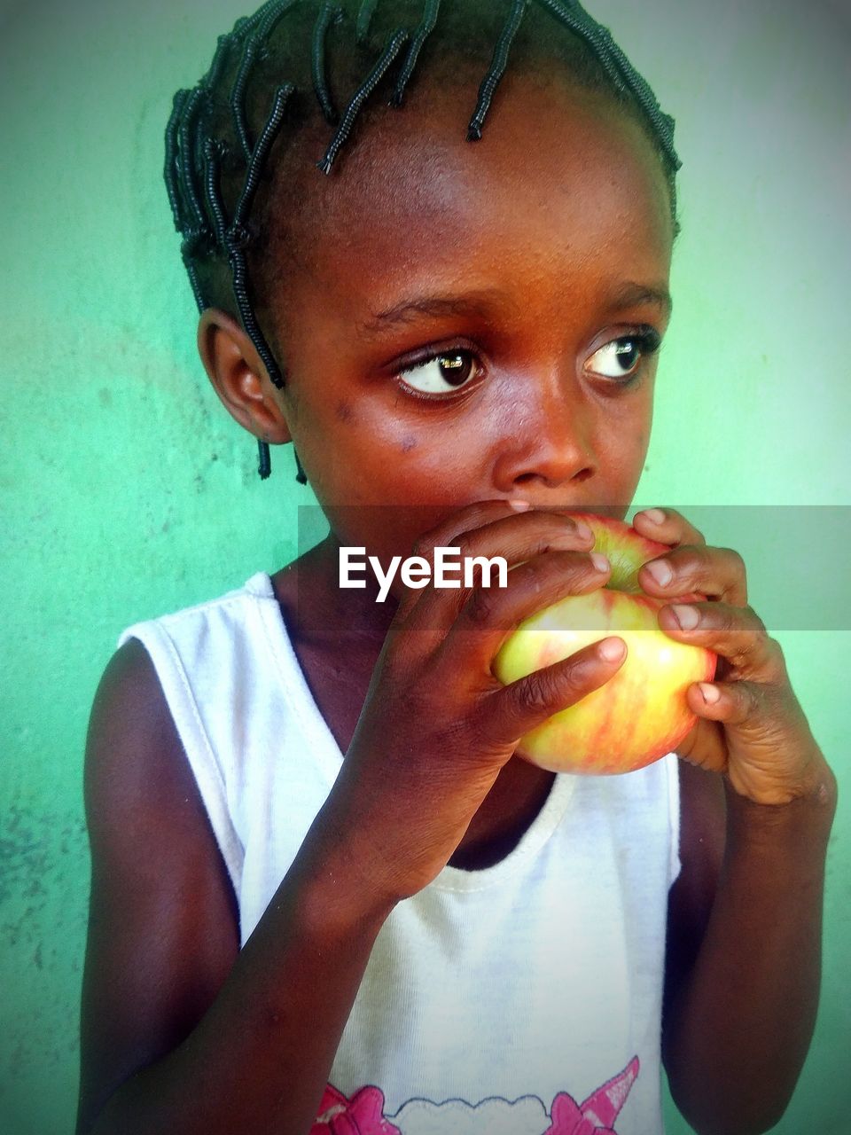 person, food, food and drink, portrait, eating, one person, child, human face, childhood, looking at camera, hungry, healthy eating, fruit, fast food, holding, skin, wellbeing, women, human mouth, clothing, female, nose, biting, lifestyles, freshness, human head, human hair, front view, snack, headshot, casual clothing, emotion, indoors, adult