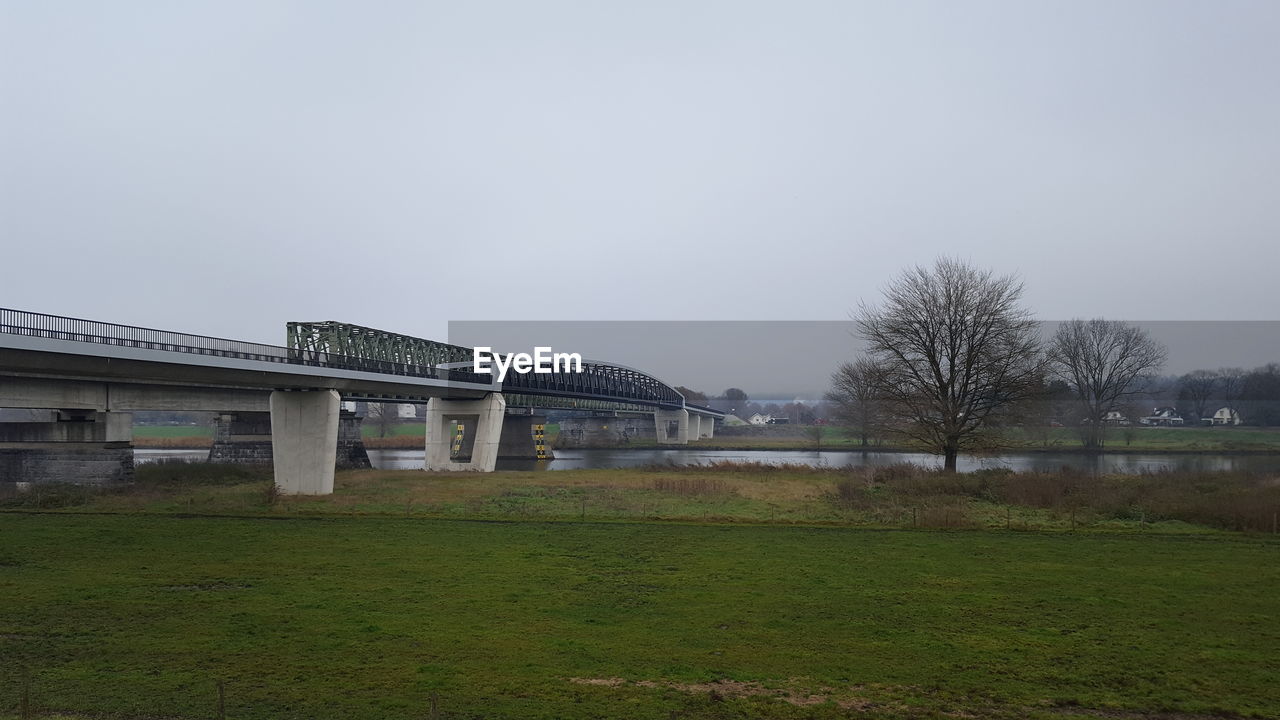 BUILT STRUCTURE ON FIELD AGAINST SKY