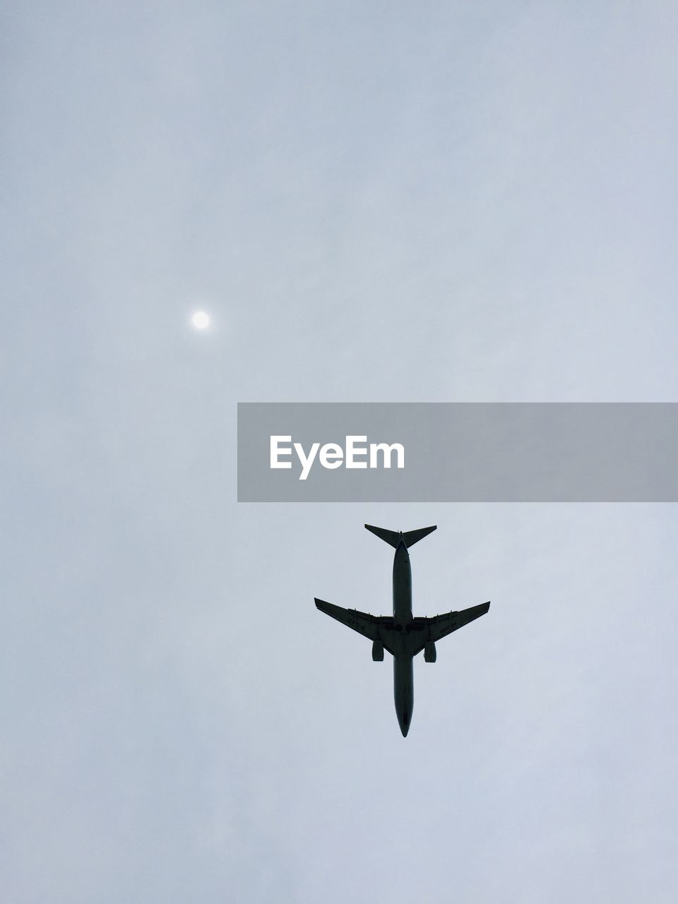 LOW ANGLE VIEW OF AIRPLANE AGAINST SKY