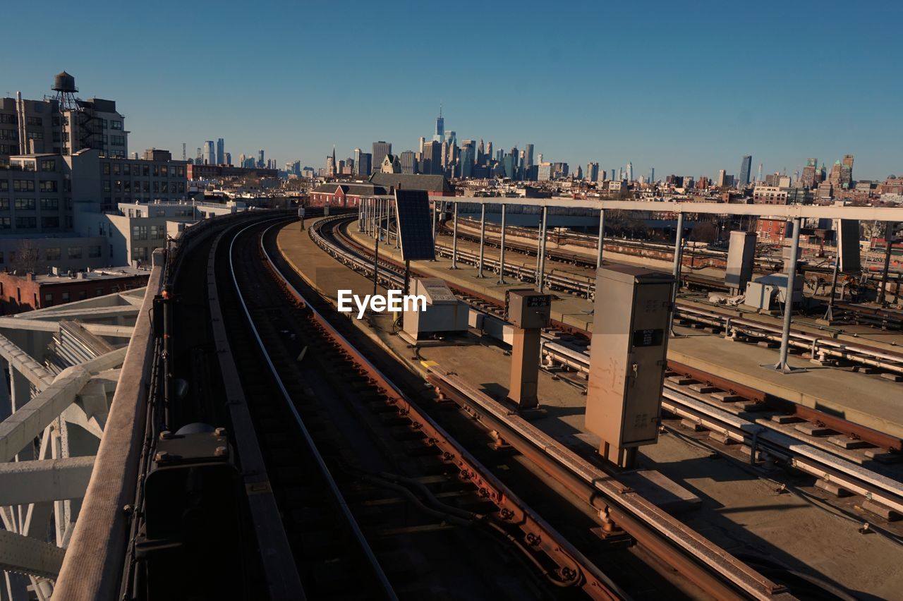 High angle view of railroad tracks amidst buildings in city