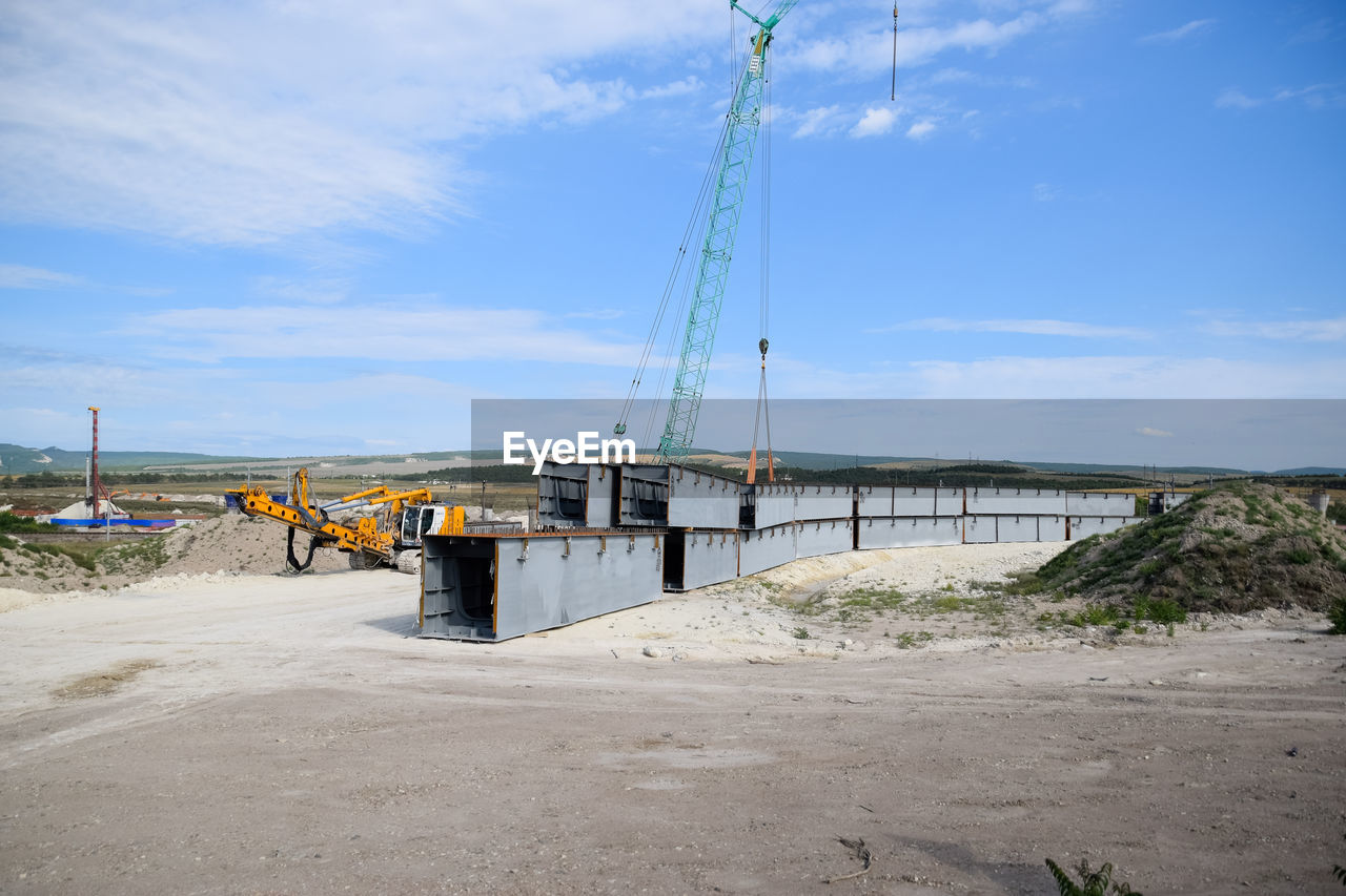 VIEW OF CONSTRUCTION SITE AGAINST SKY