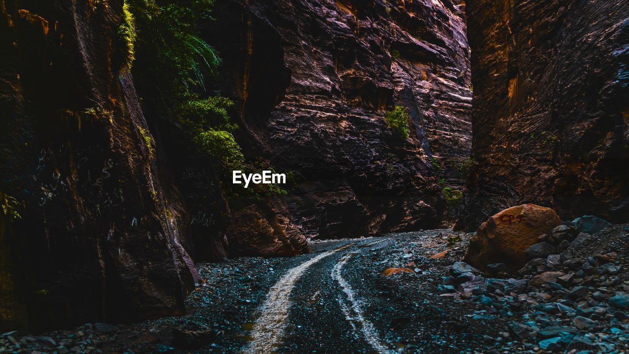 Scenic view of narrow road between canyons