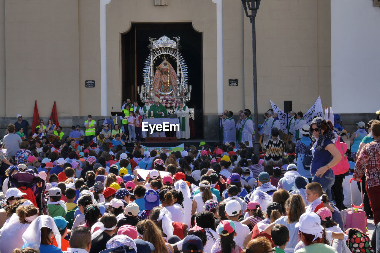 GROUP OF PEOPLE IN TEMPLE