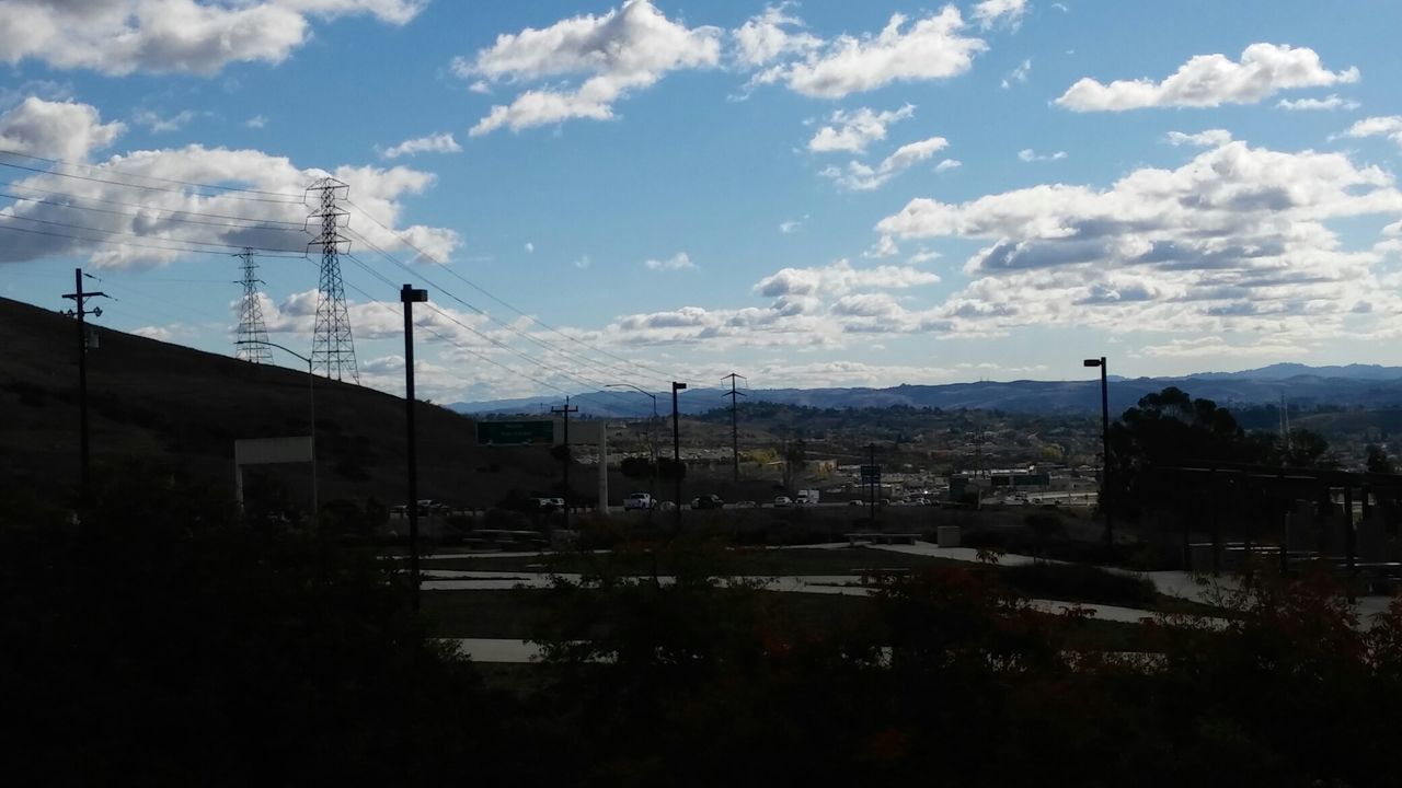 View of landscape against cloudy sky