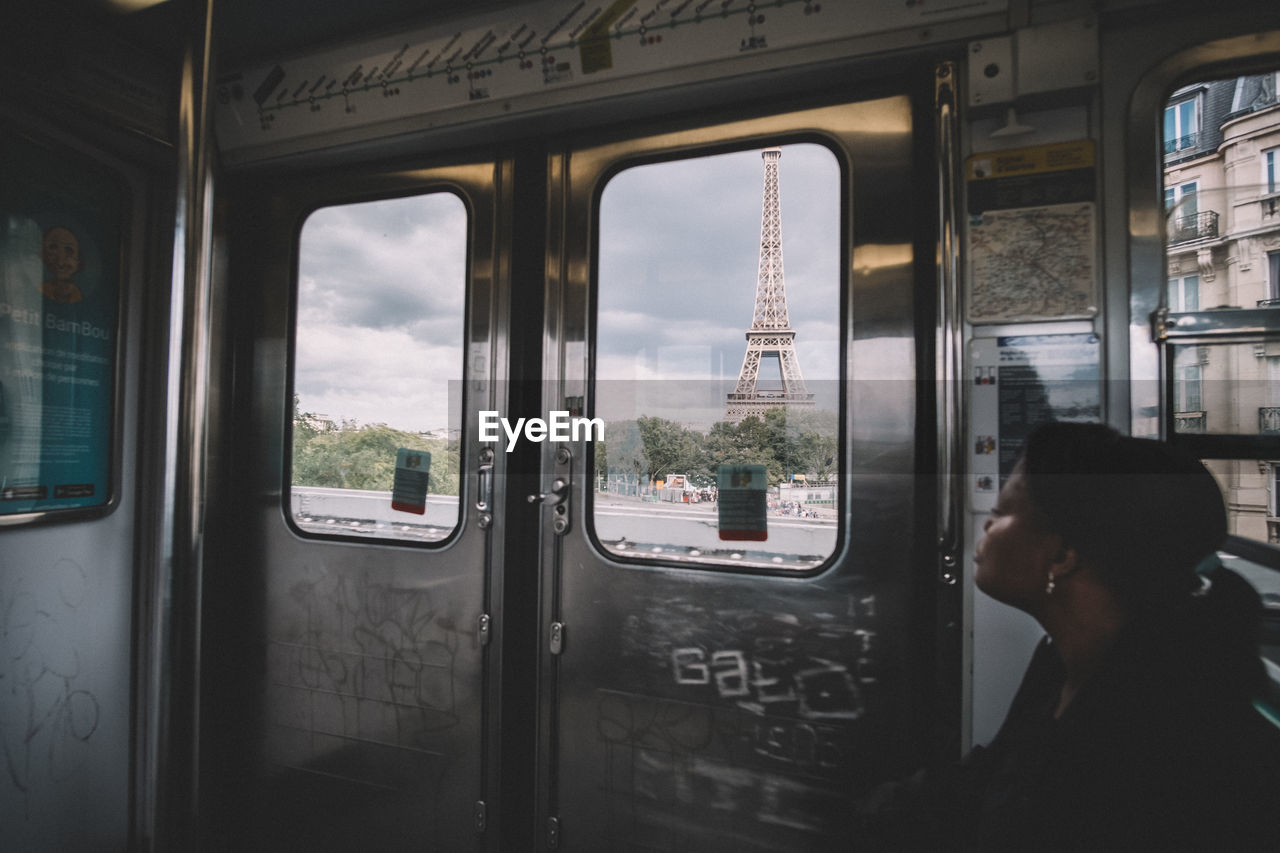 REFLECTION OF MAN IN TRAIN