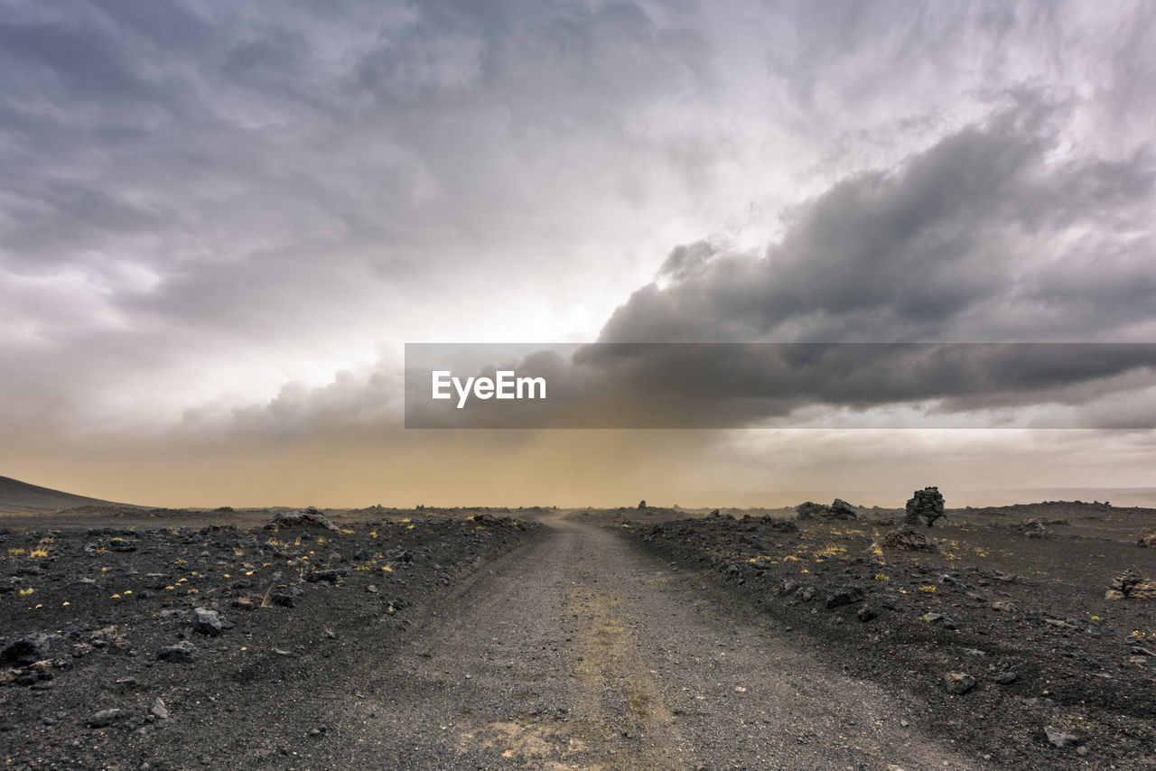 DIRT ROAD AGAINST SKY