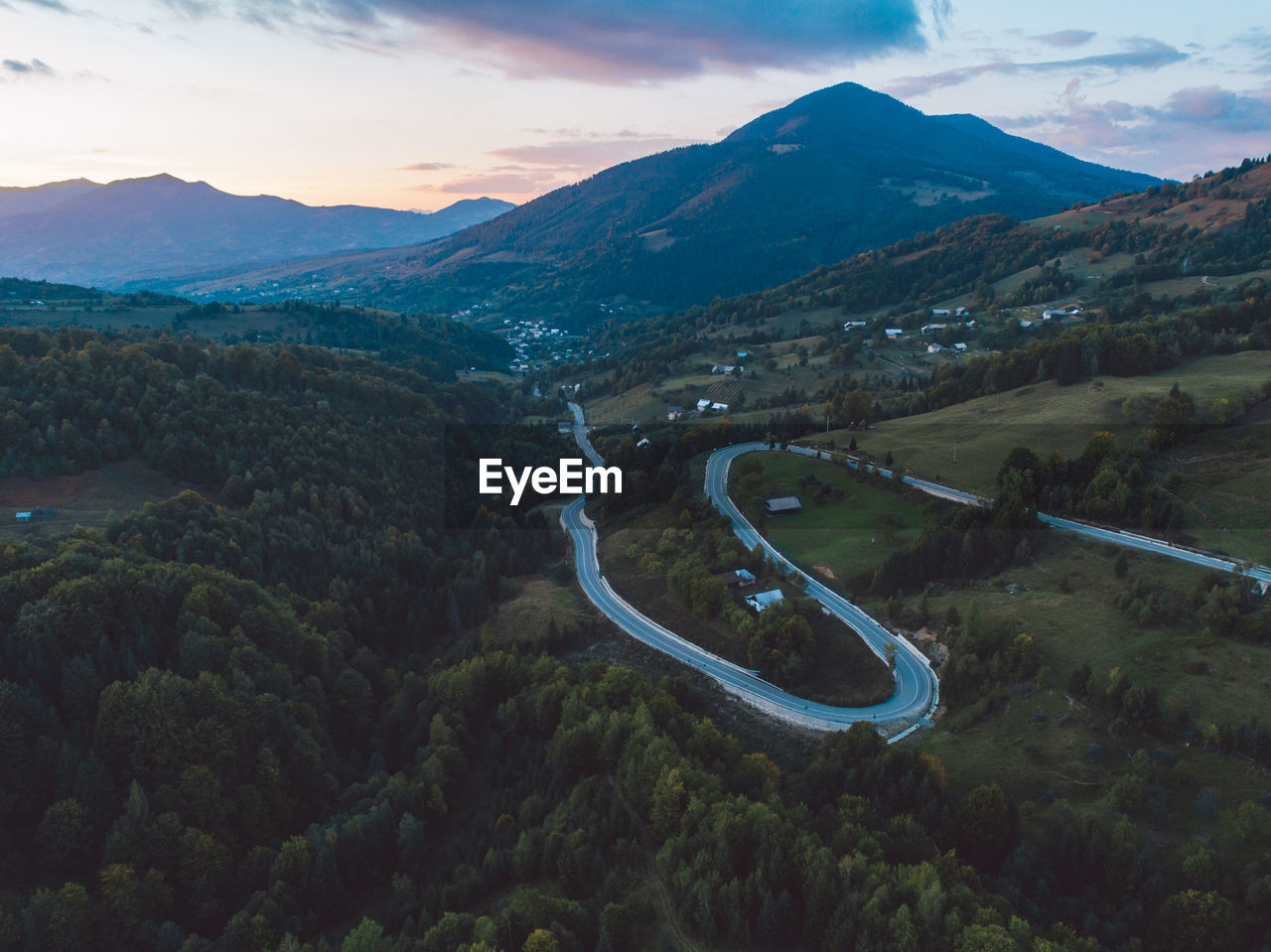 High angle view of road amidst mountains against sky