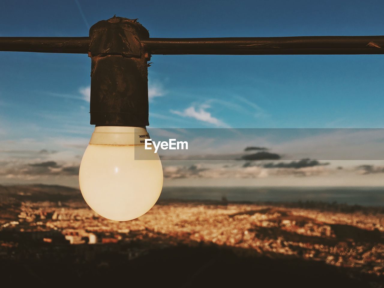 CLOSE-UP OF LIGHT BULB ON LAND