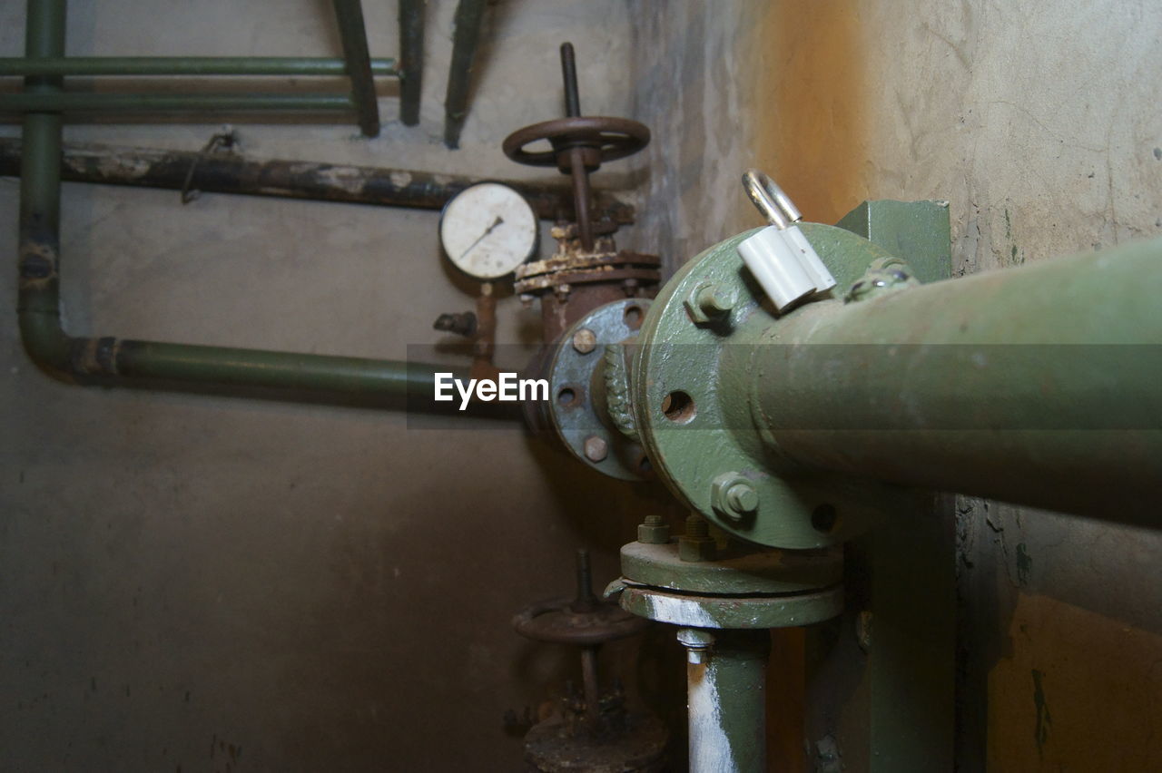 CLOSE-UP OF RUSTY MACHINERY