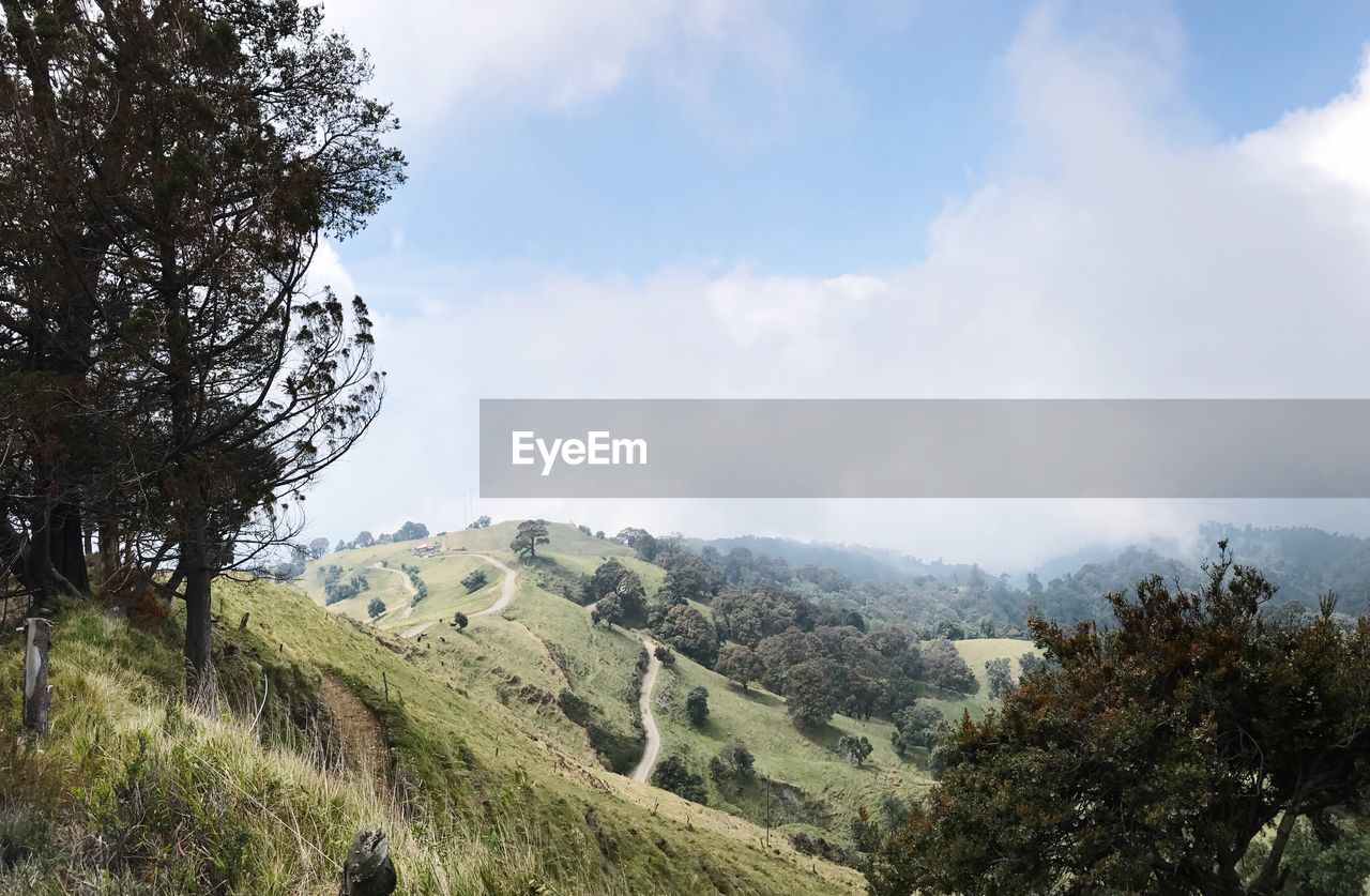 LOW ANGLE VIEW OF MOUNTAINS AGAINST SKY