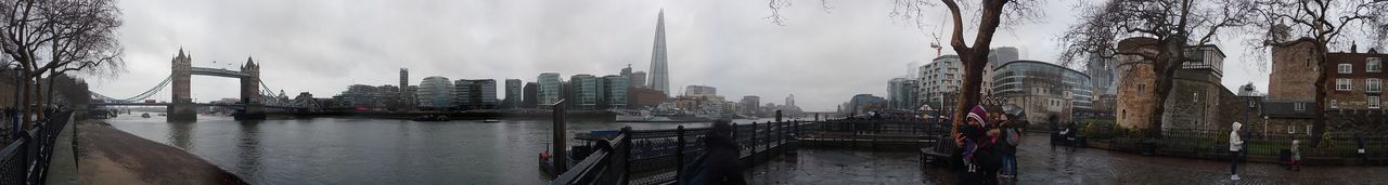 PANORAMIC VIEW OF CITY BY SEA AGAINST SKY