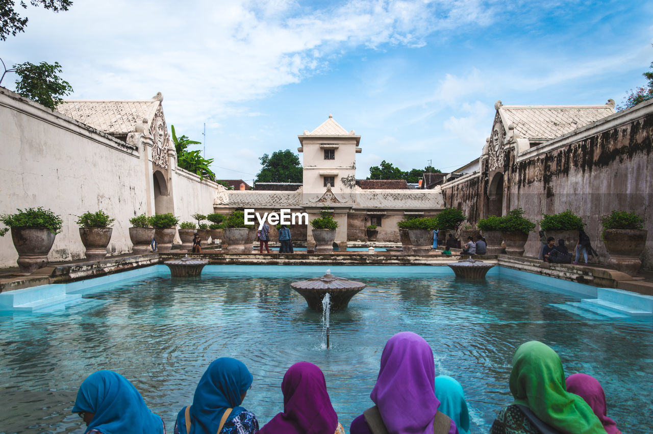 Group of headscarf-wearing women at the indonesian sultan's palace in jakarta, java.