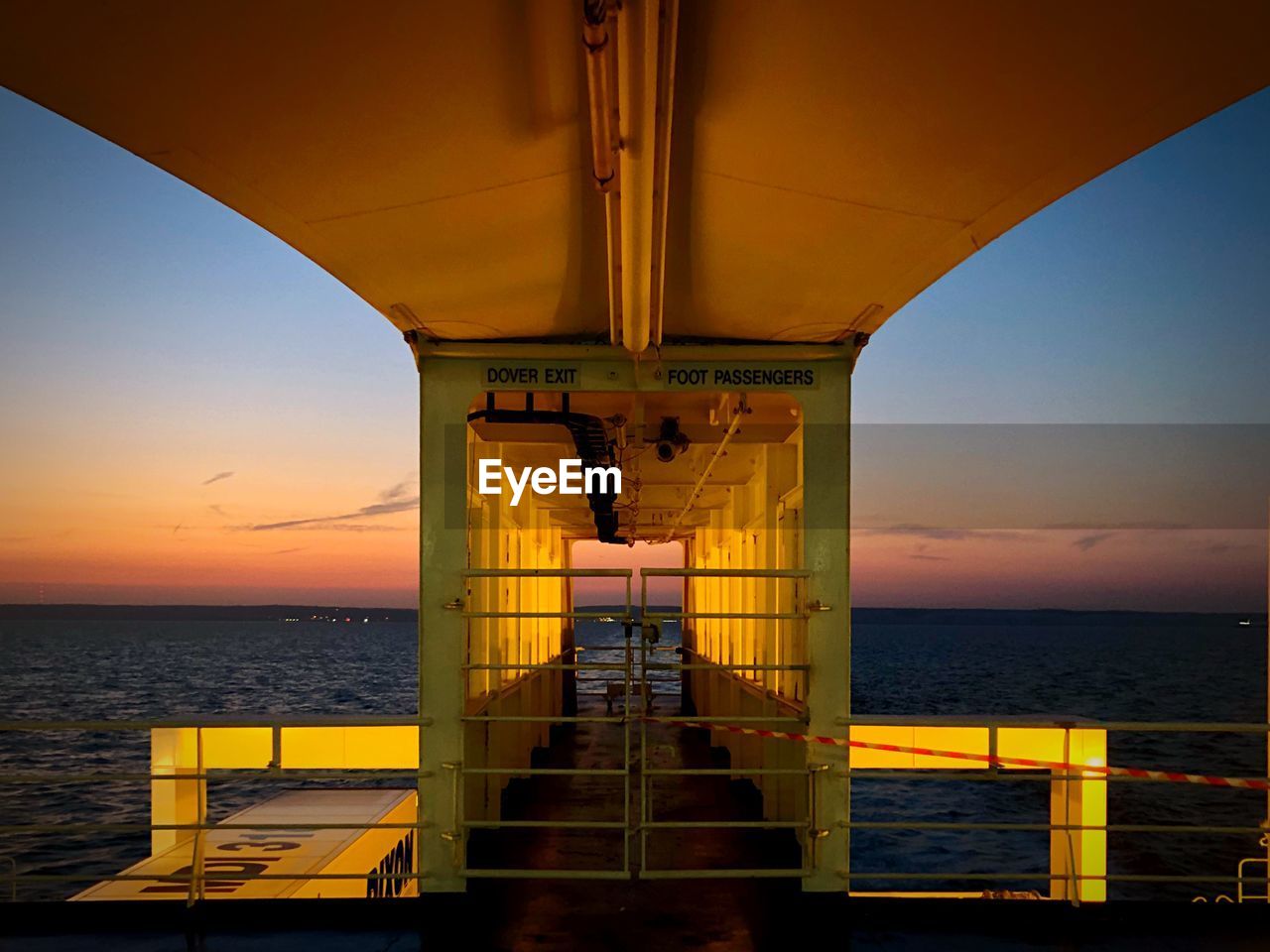 VIEW OF BRIDGE OVER SEA AGAINST SKY