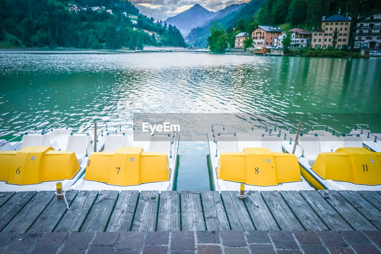 Yellow swimming pool by lake