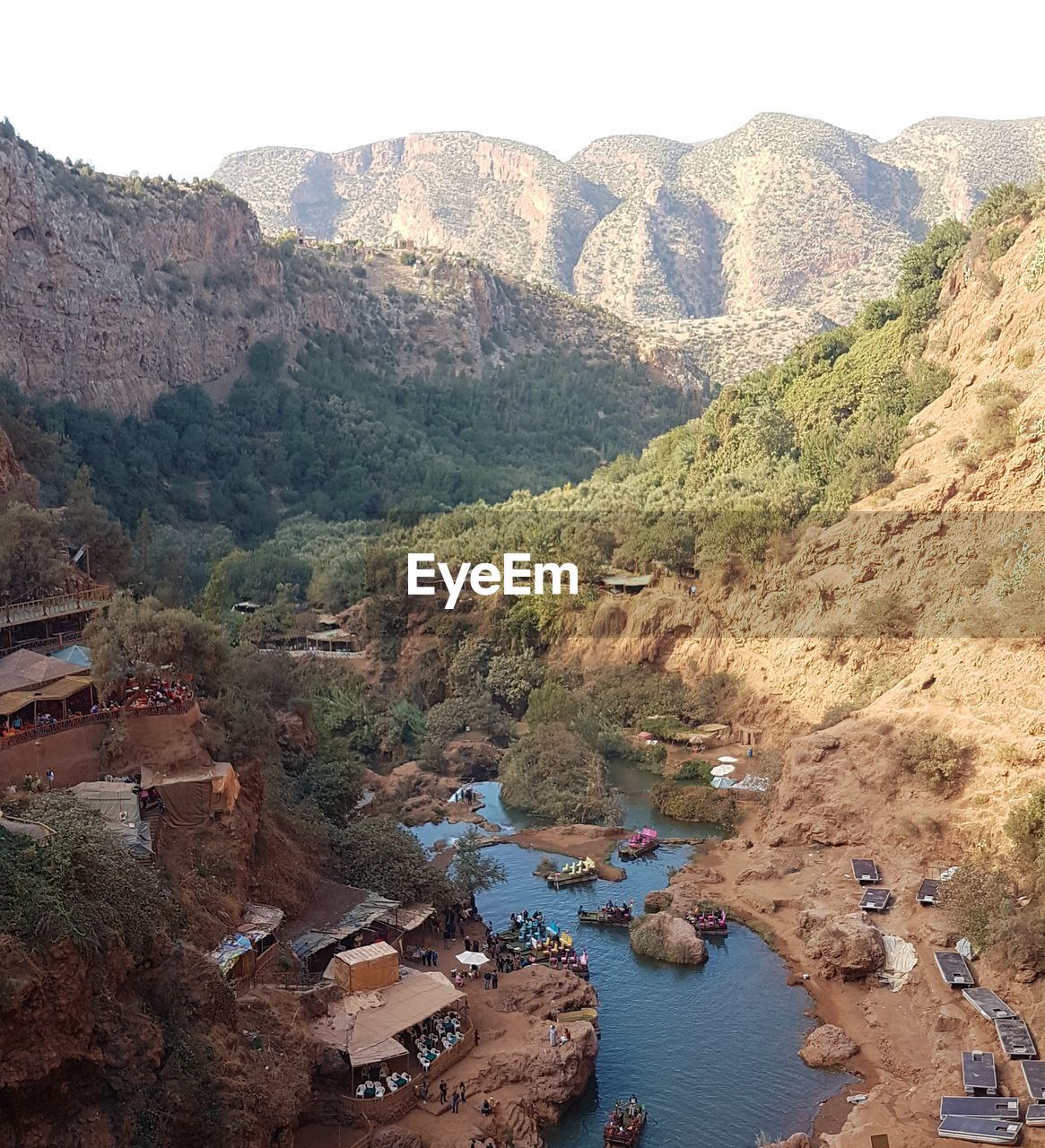 High angle view of landscape and mountains against clear sky