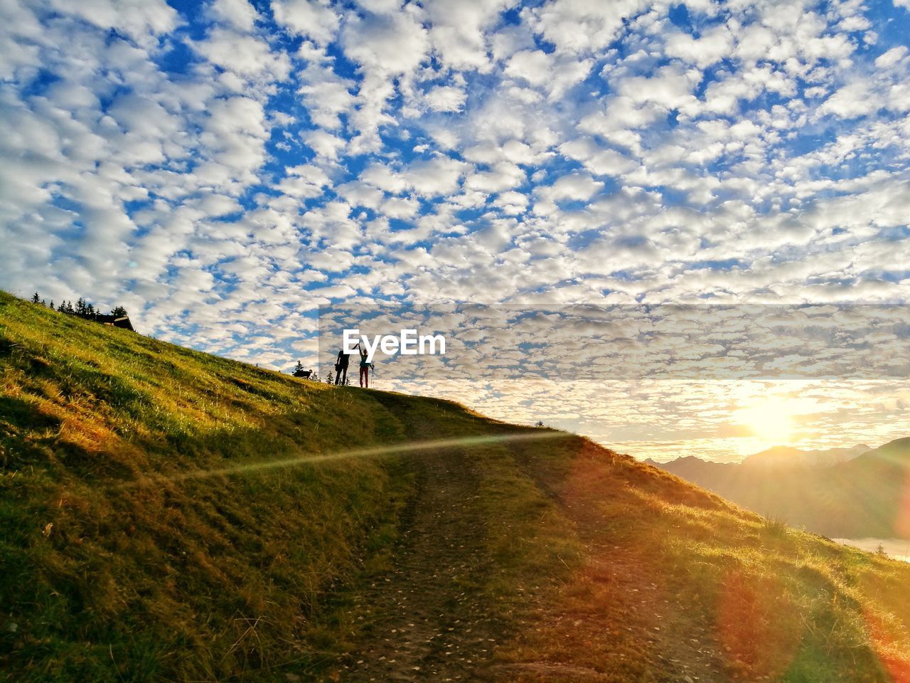 SCENIC VIEW OF LAND AGAINST SKY DURING SUNSET