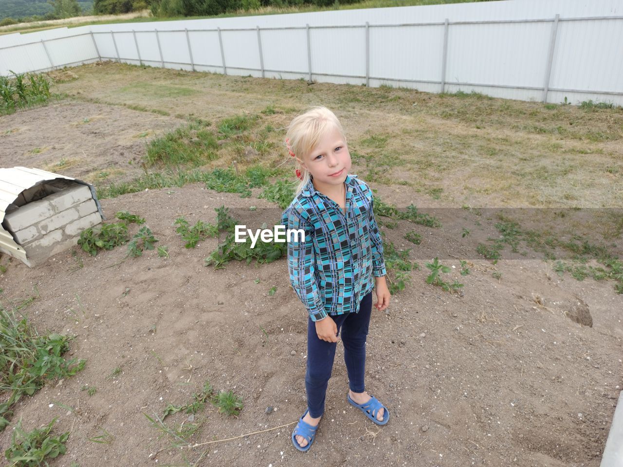 High angle portrait of girl standing on land