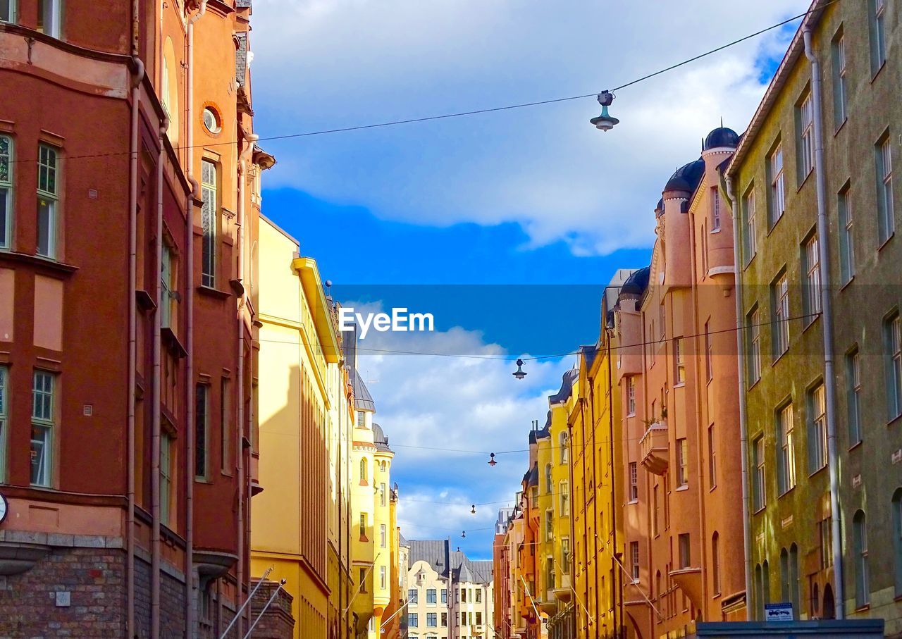 Low angle view of buildings against sky in city