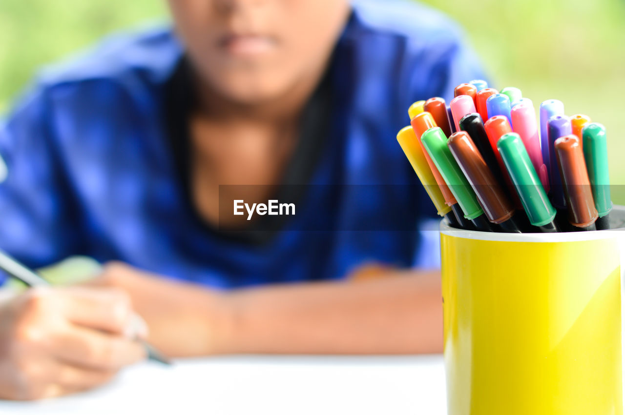 Pencils against boy 