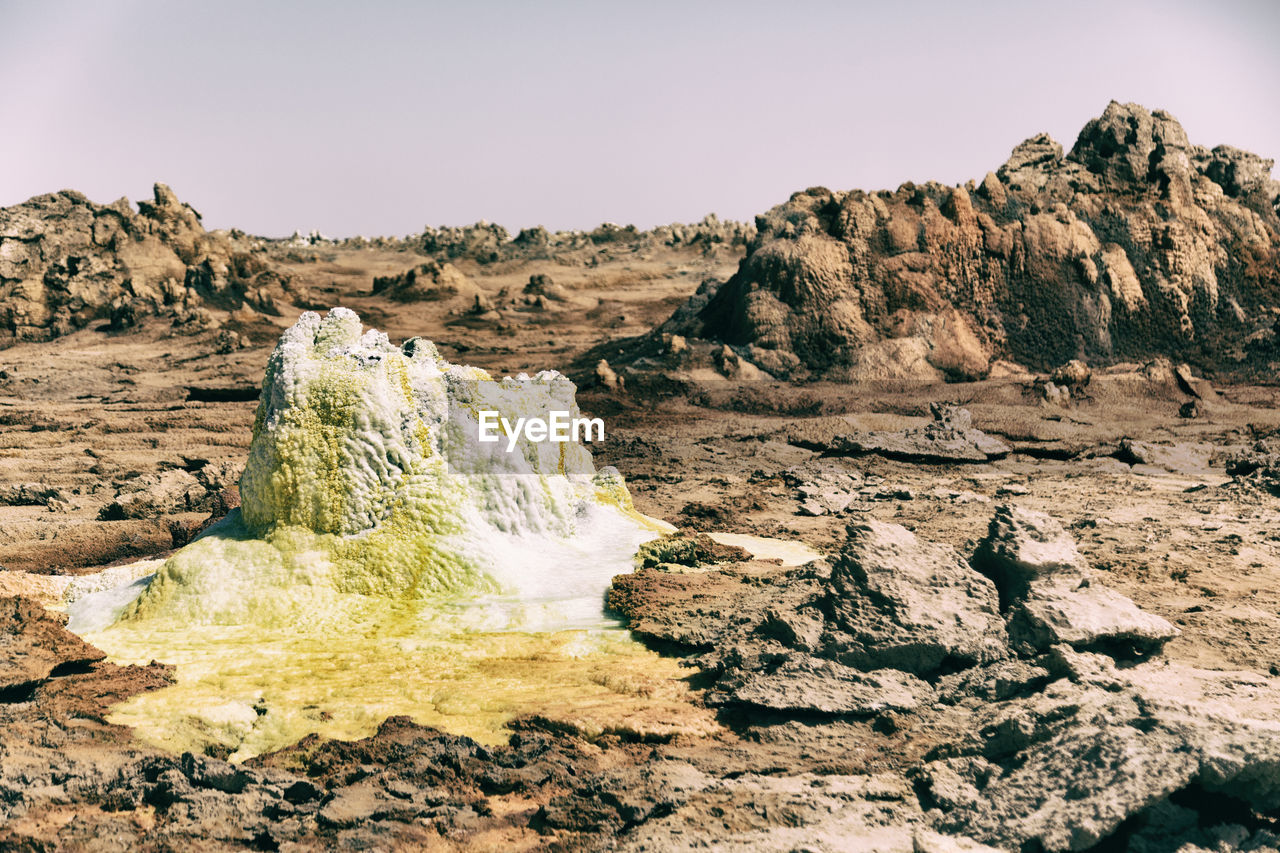 Scenic view of rock formations against sky