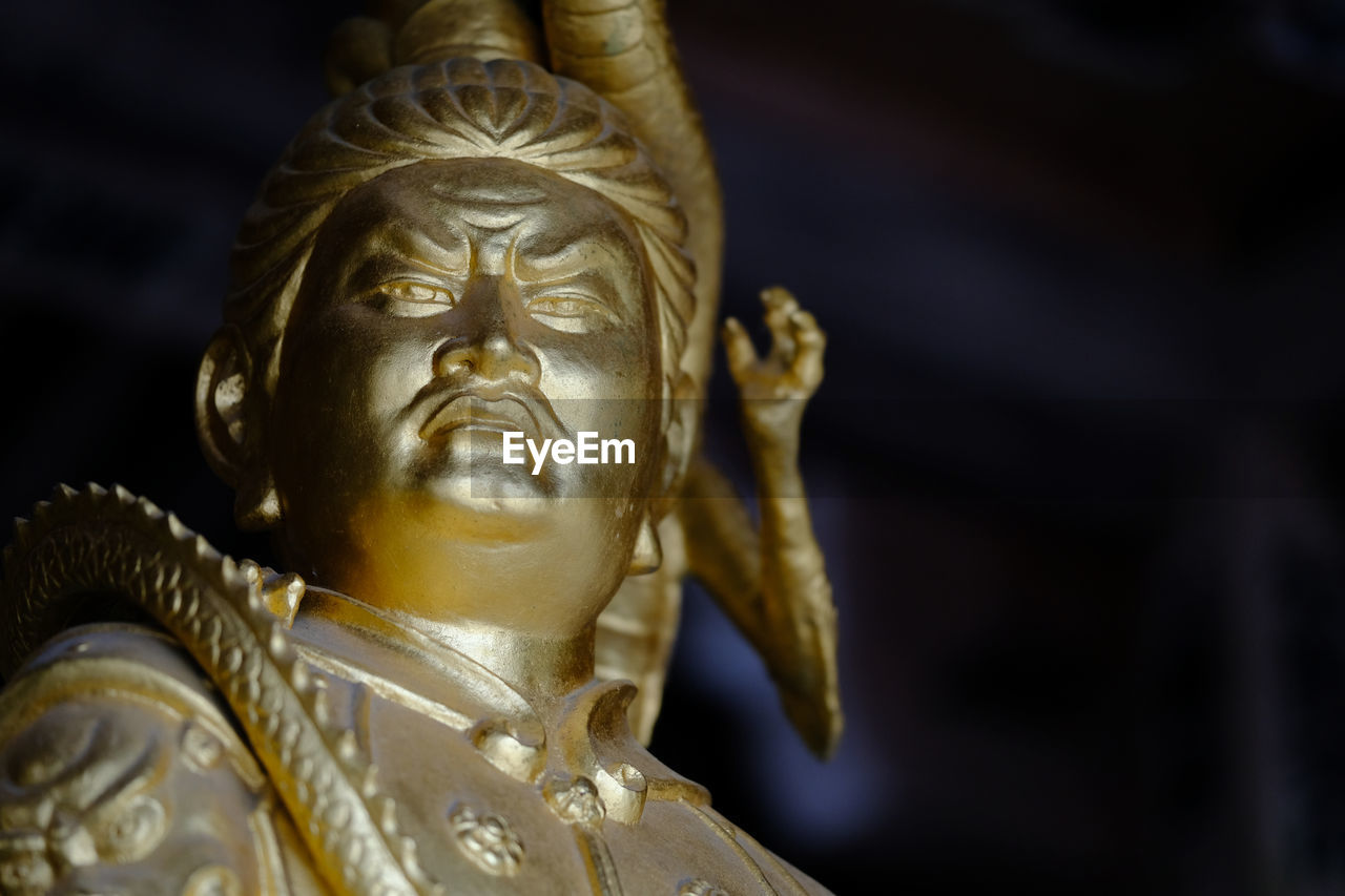 Close-up of gold statue