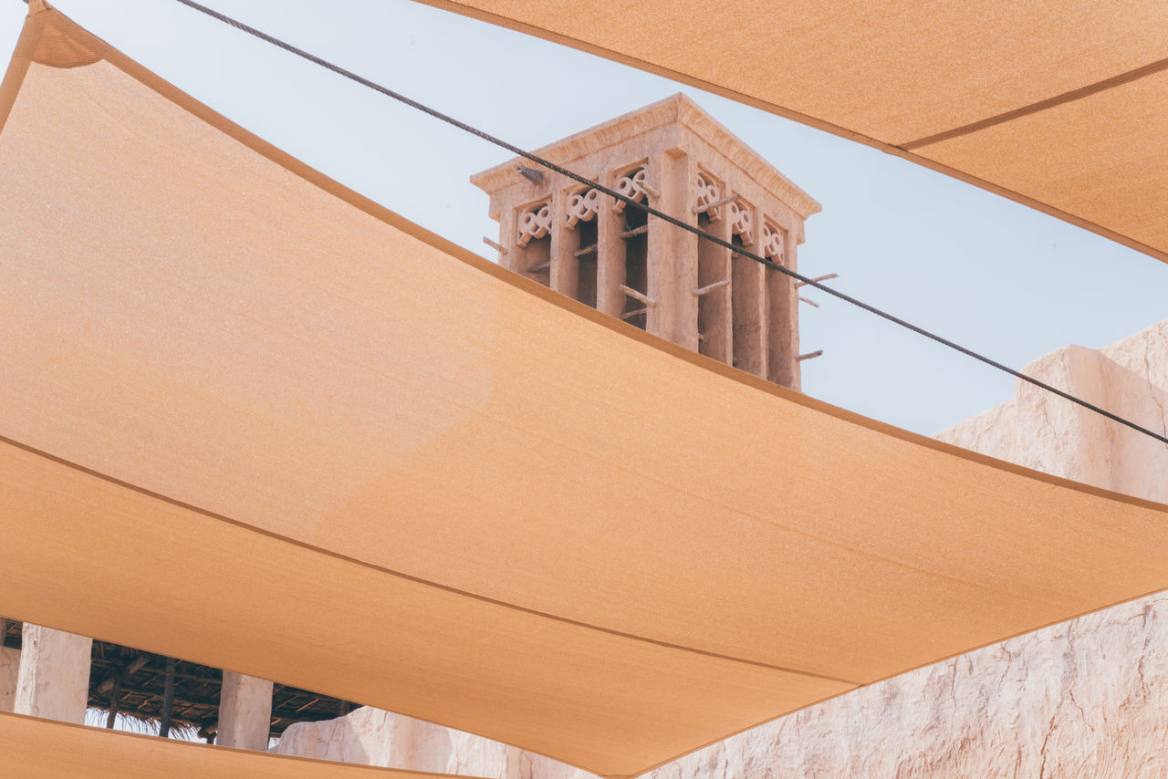 LOW ANGLE VIEW OF BUILDINGS AGAINST CLEAR SKY