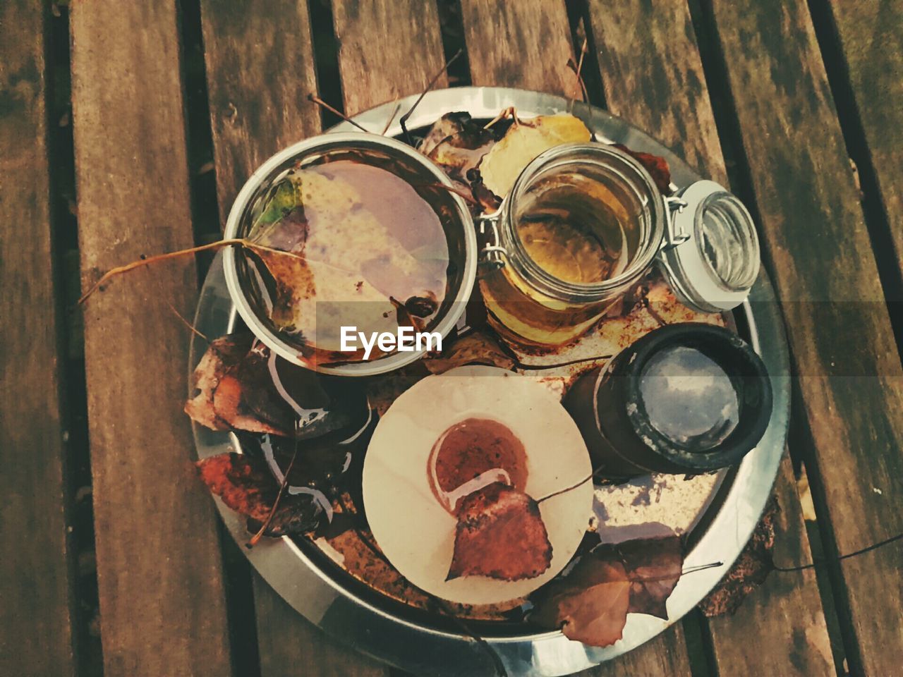 High angle view of drinks in plate on wooden table