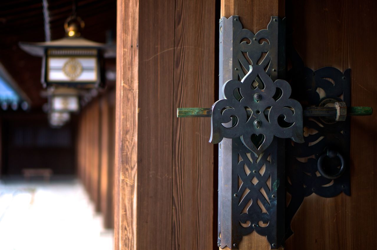 Close-up of latch on wooden door
