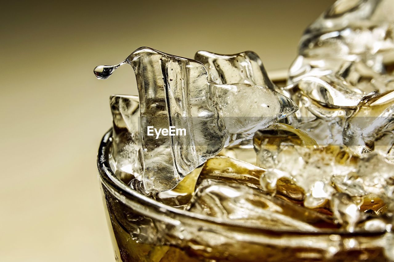 CLOSE-UP OF ICE CUBES ON TABLE