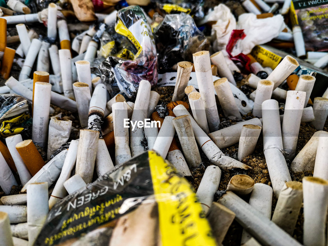 HIGH ANGLE VIEW OF CIGARETTE SMOKING