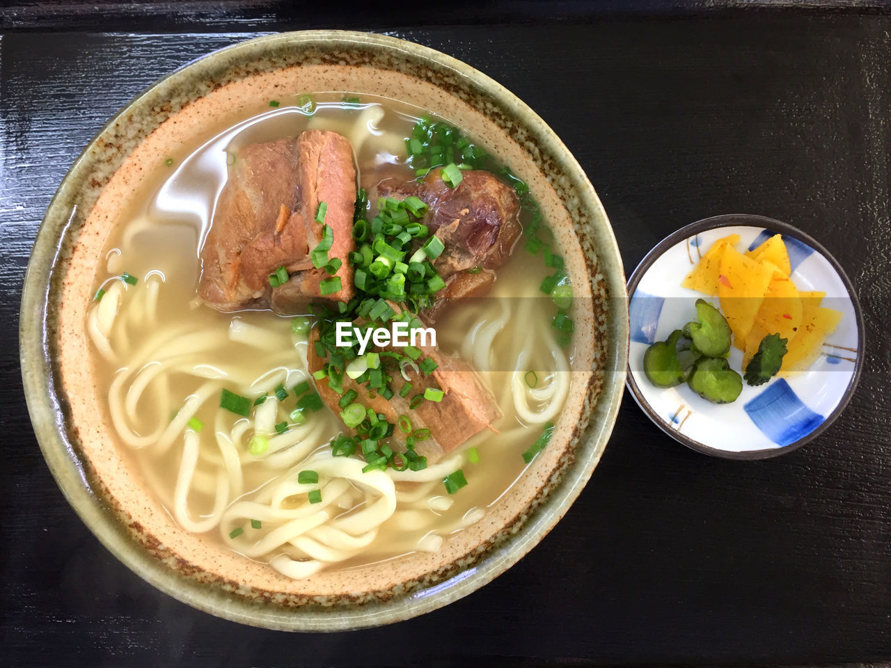High angle view of japanese udon with beef meal served on table