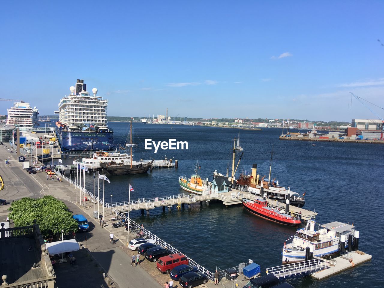 HIGH ANGLE VIEW OF SHIP MOORED AT HARBOR IN CITY