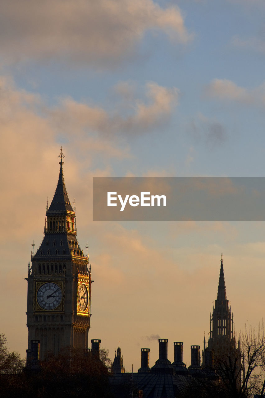 Big ben and palace of westminster tower against sky