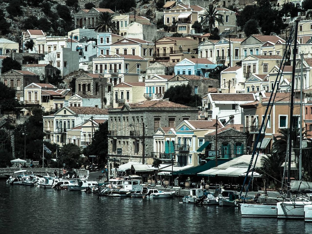 BOATS MOORED IN HARBOR