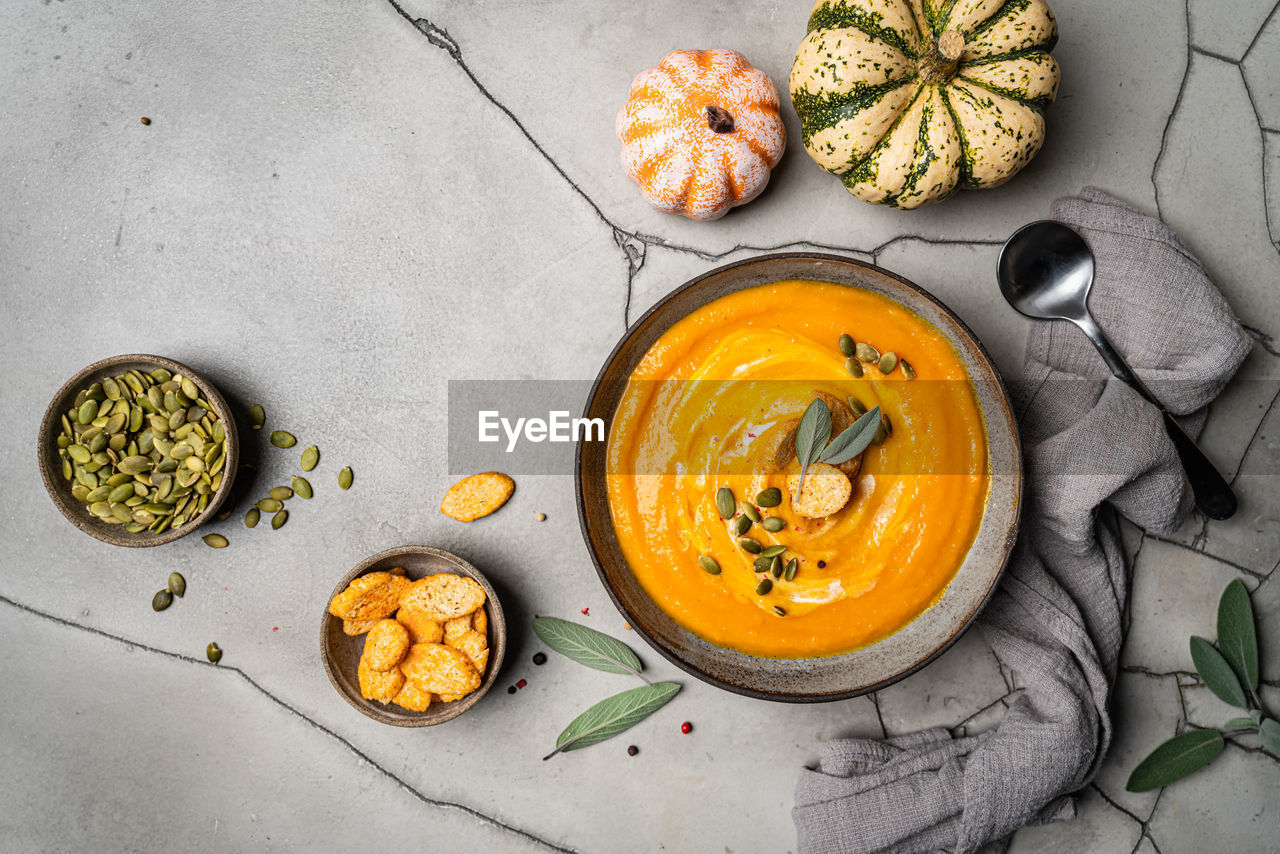 food and drink, food, healthy eating, plant, vegetable, freshness, high angle view, wellbeing, yellow, bowl, no people, fruit, produce, studio shot, orange color, indoors, crockery, pumpkin, vegetarian food, directly above, still life, spice