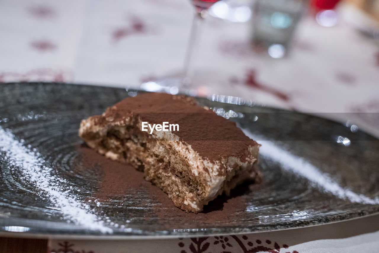 Close-up of tiramisu served in dish at hotel